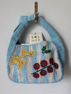 Sol & Mer Beaded pasta tomato blue striped bag